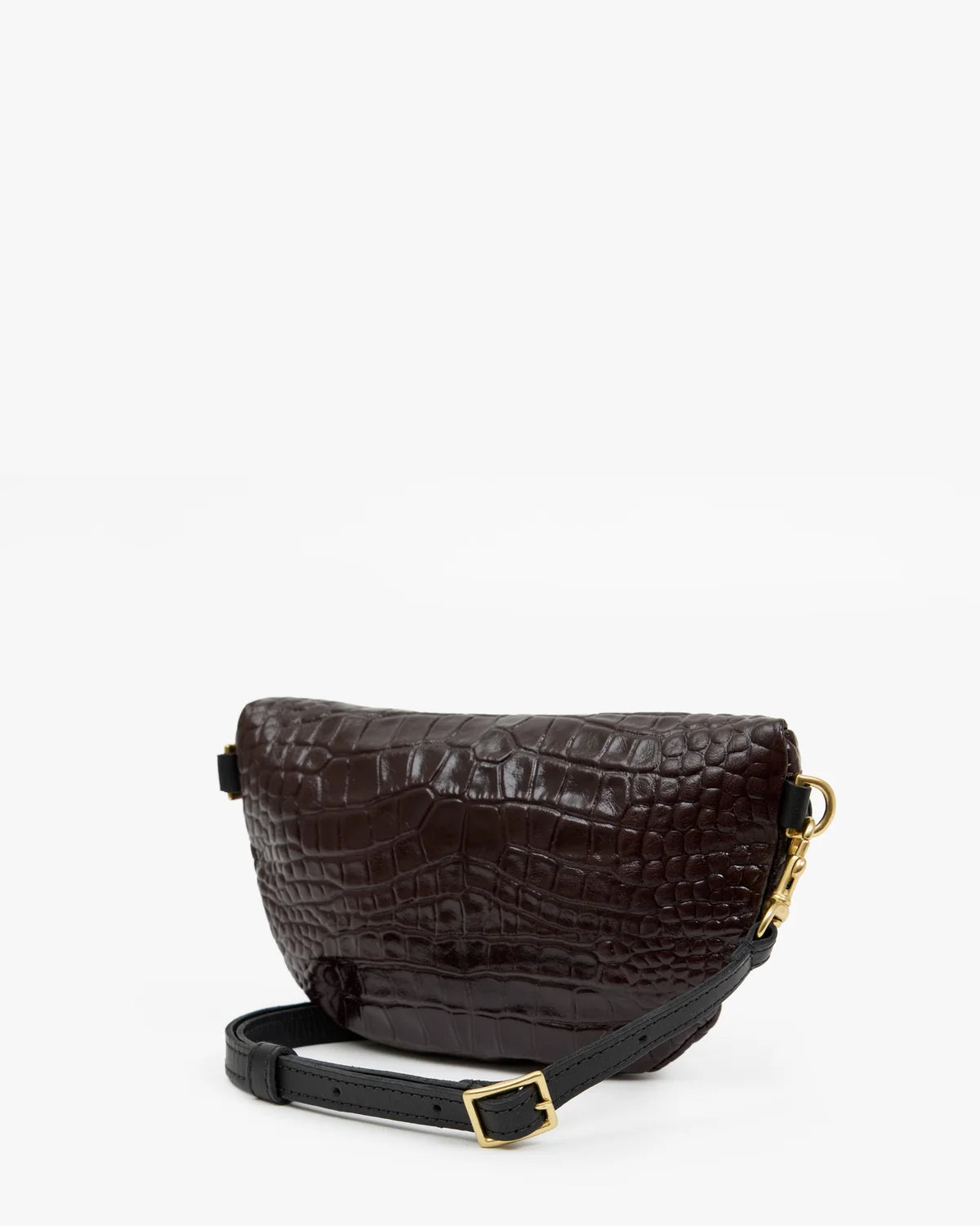 A dark brown crocodile-embossed leather crossbody bag with a black adjustable strap and gold-tone hardware, photographed on a clean white background.