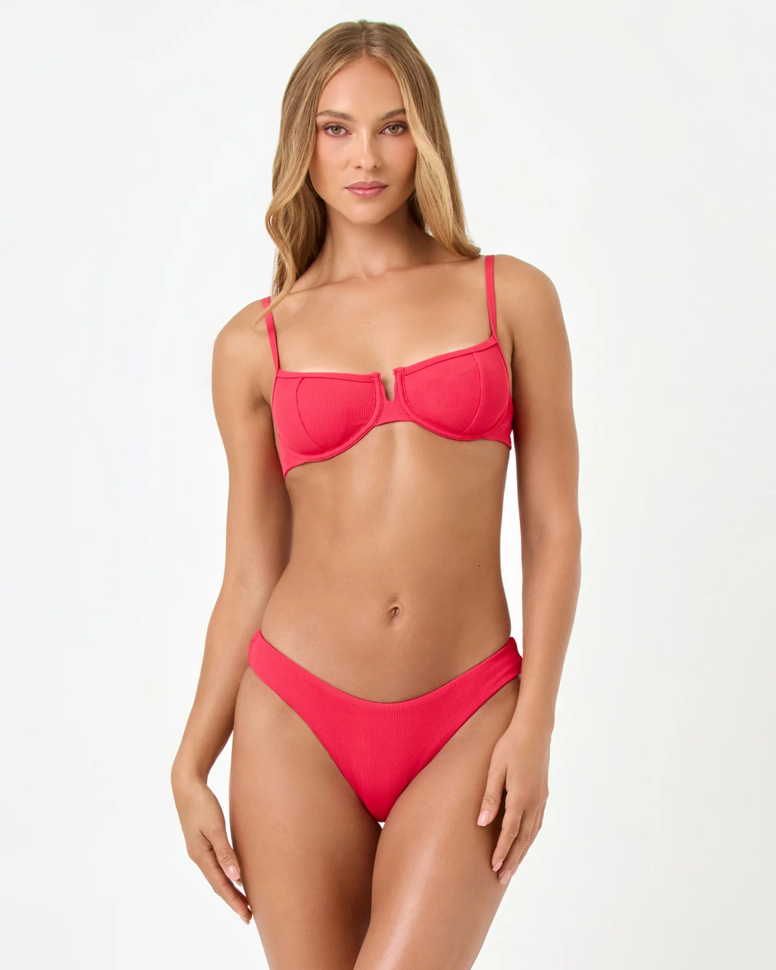 Woman wearing a red bikini on a white background