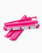 Pink plastic strips with colorful labels on a white background
