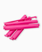 Stack of pink plastic straws on a white background