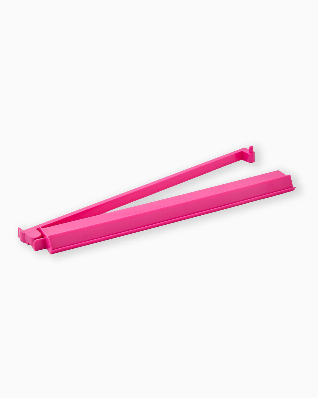 Pink plastic tool on a white background