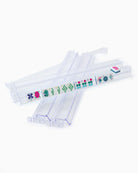 Clear plastic straws with colorful designs on a white background