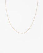 Gold chain necklace on a white background