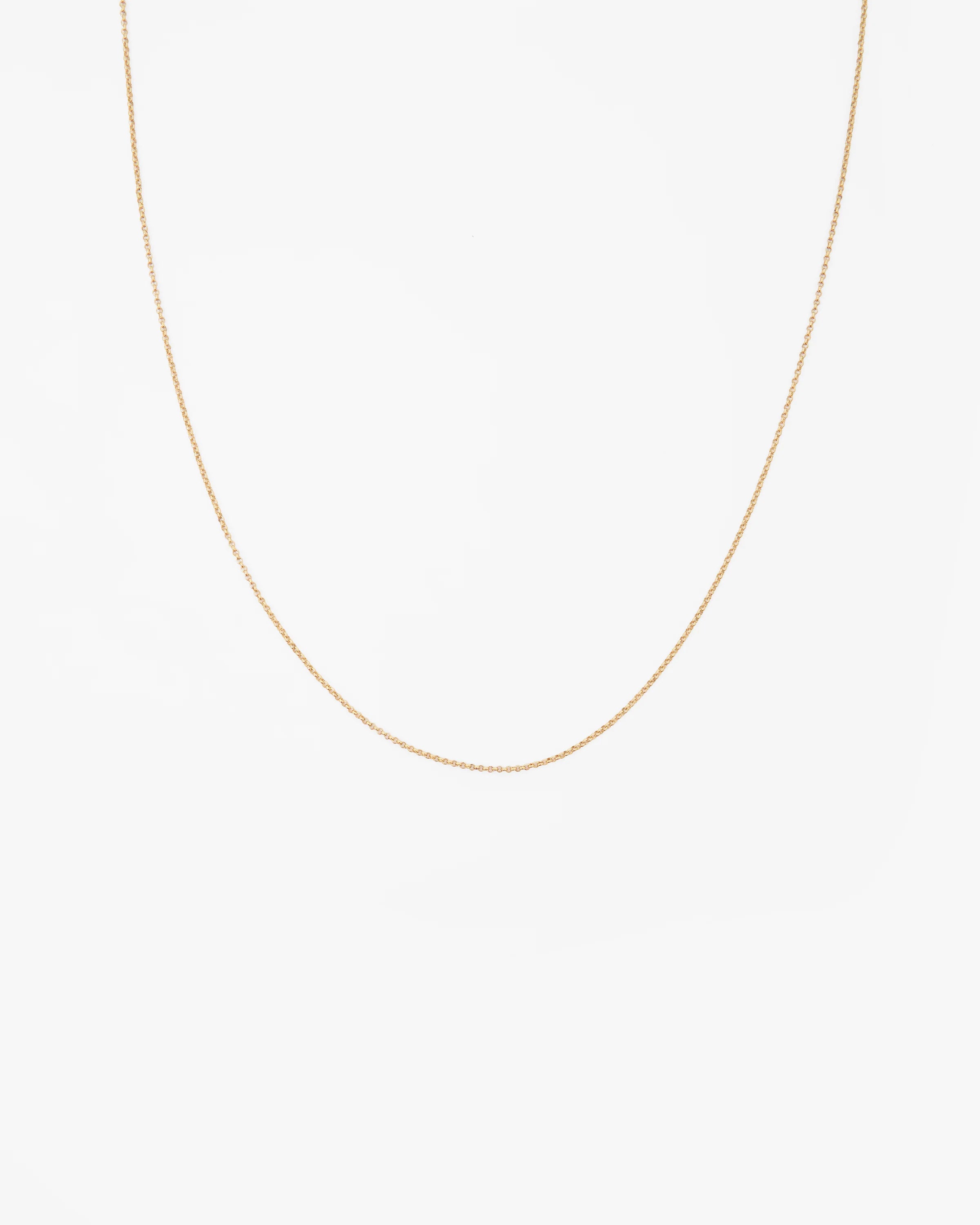 Gold chain necklace on a white background