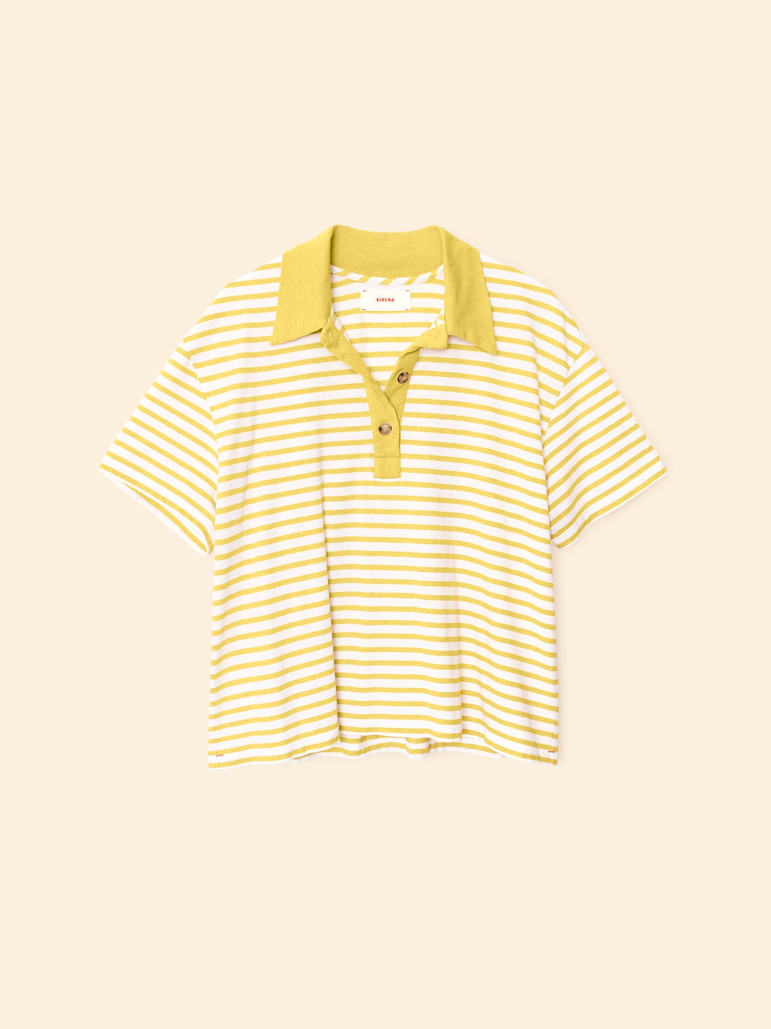 Yellow and white striped polo shirt on a beige background