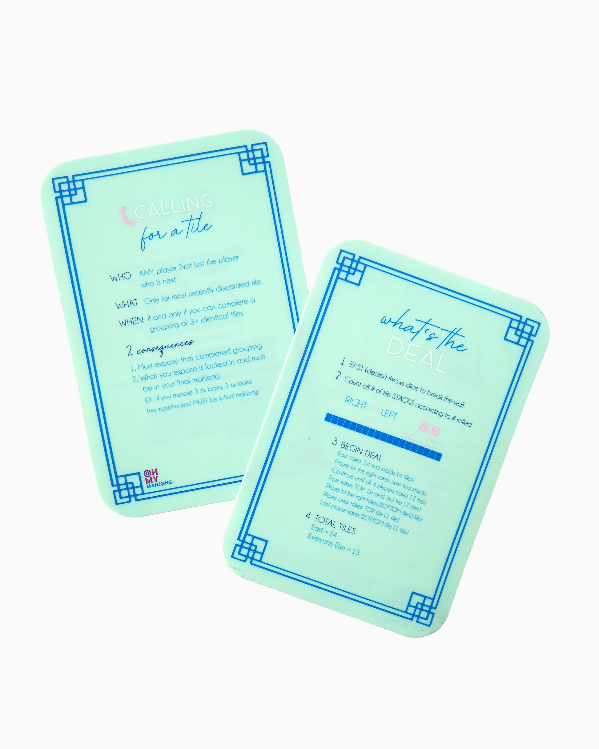 Two mint green tarot card decks with blue borders, displayed overlapping on a clean white background. One card is facing up with the title 'Calling for a Tile' and instructions, while the other is facing down with the title 'What's the Deal' and a blue highlighted box.