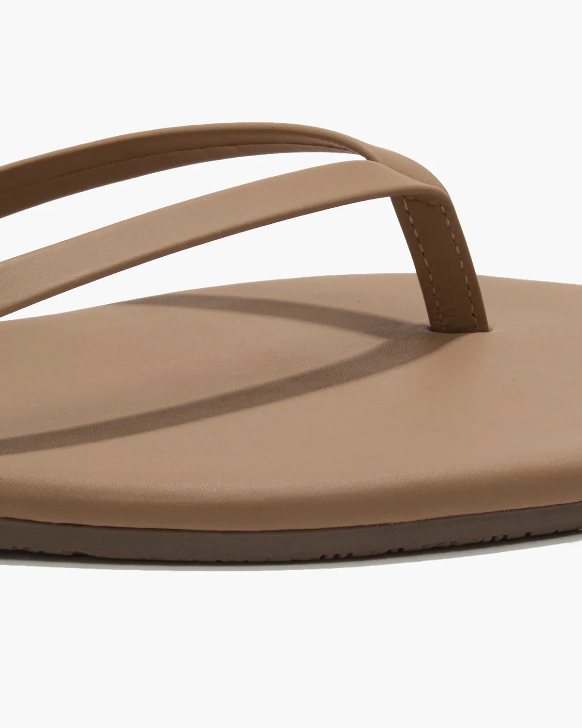 Brown sandal with a strap on a white background