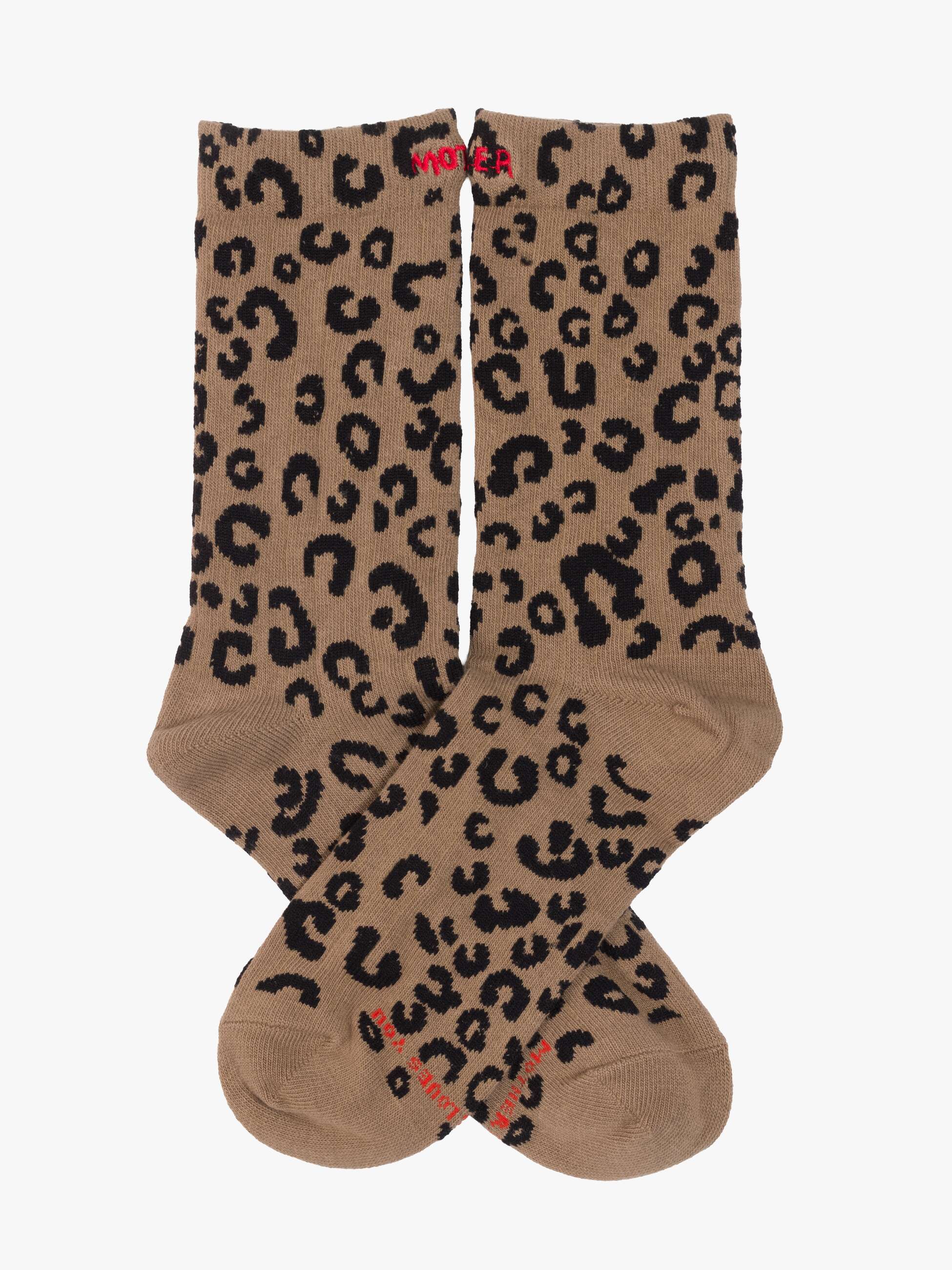 Pair of brown socks with black leopard print pattern on a white background