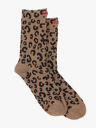 Pair of brown socks with black leopard print on a white background