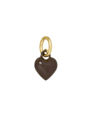 Heart-shaped charm with gold ring on a white background