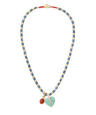 Necklace with blue, beige, and red beads on a white background
