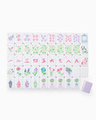 Set of decorative tiles with floral and geometric designs on a white background