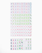 Set of small stickers with various designs on a white background