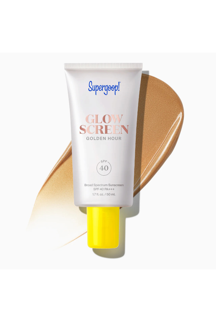 A tube of Superseep! Glow Screen Golden Hour Broad Spectrum Sunscreen SPF 40, featuring a white tube with a bright yellow cap, set against a diagonal smear of golden-tan sunscreen cream on a clean white background.