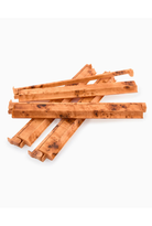Stack of wooden chew sticks on a white background