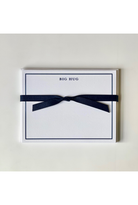 Card with 'BIG HUG' text and a navy ribbon on a light gray background
