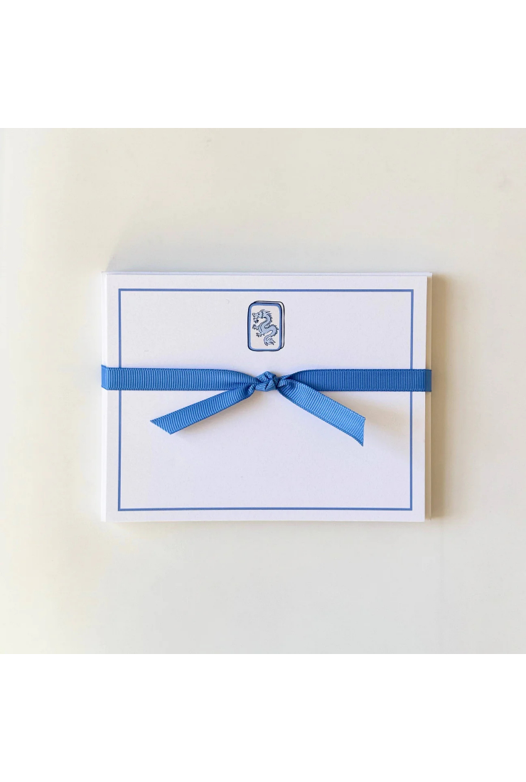 Notebook with a blue ribbon on a white background