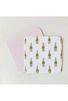 Two placemats with champagne bottle pattern on a light background