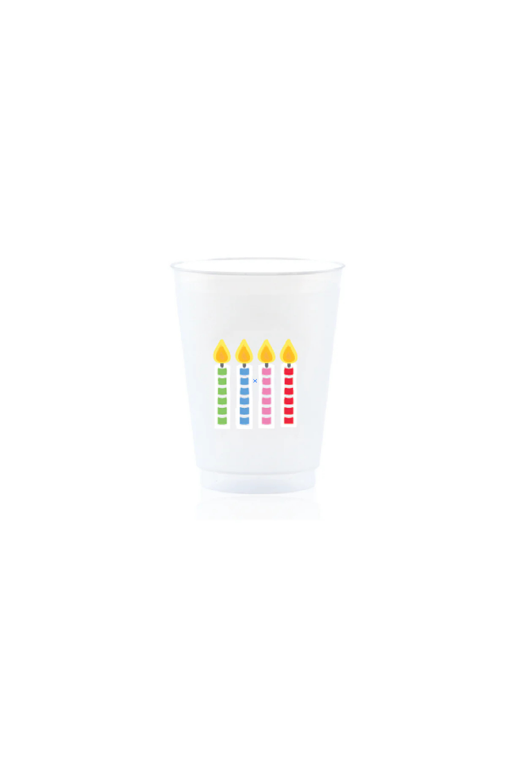 Clear glass with colorful candle illustrations on a white background