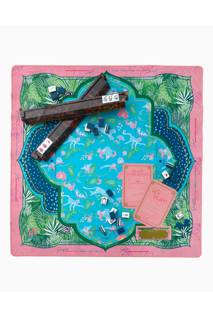 Colorful board game with pieces and cards on a decorative mat