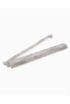 Two white marble-like sticks on a white background