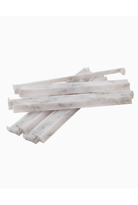 Stack of white marble-like sticks on a white background