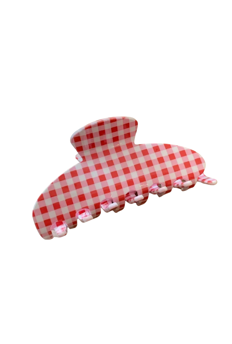 A large claw-style hair clip with a red and white gingham checkered pattern, shown on a plain white background.