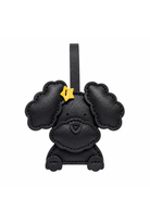 A black leather poodle-shaped car keychain charm with a small yellow star accessory on its ear, shown against a plain white background.