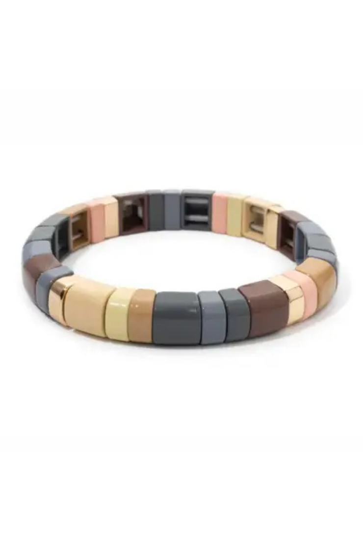 A segmented stretch bracelet featuring alternating rectangular beads in dark gray, brown, beige, and rose gold, displayed on a clean white background.