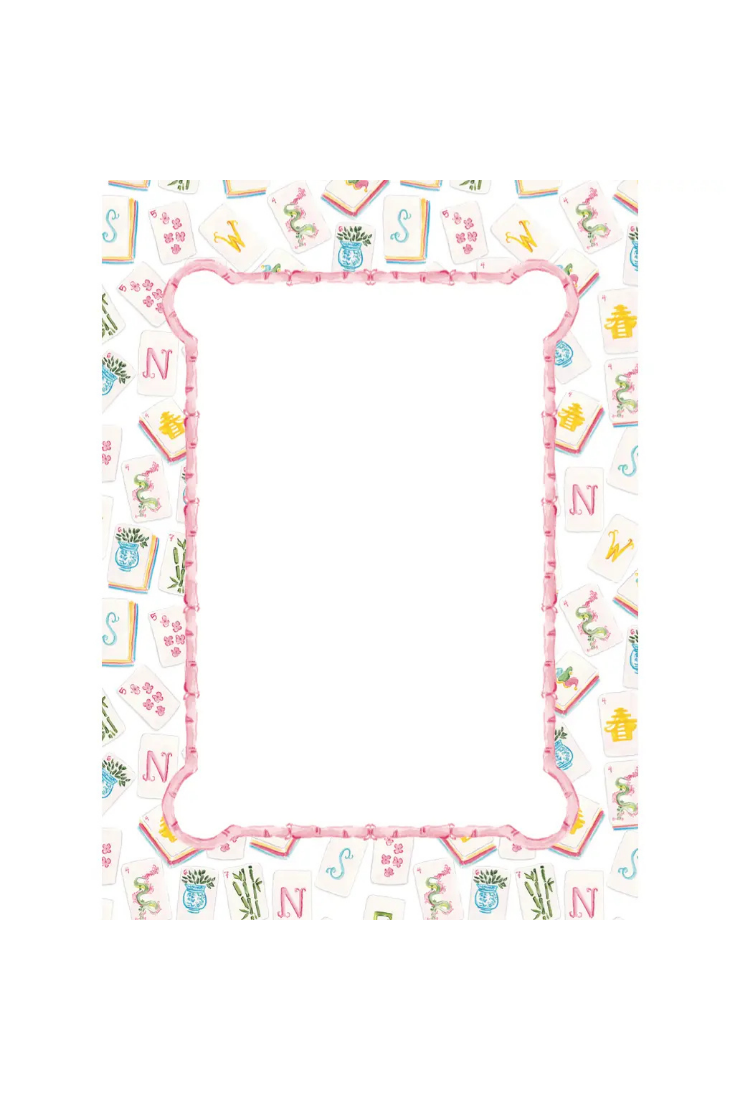 A rectangular decorative frame design with a white center and a pink border, surrounded by a whimsical pattern of playing cards, letters, and small illustrations in pastel colors.