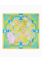A square game board printed with a decorative tropical and architectural pattern in pastel green, blue, pink, and yellow, shown on a white background with playing pieces and cards.