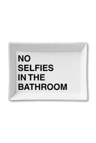 A rectangular white ceramic tray with rounded corners and bold black text that reads 'NO SELFIES IN THE BATHROOM' on a clean white background.