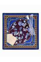 A square Jostein prayer rug set displayed flat against a white background, featuring a dark blue outer border, a central navy and burgundy floral medallion, gold geometric accents, clear plastic handles, and prayer cards.