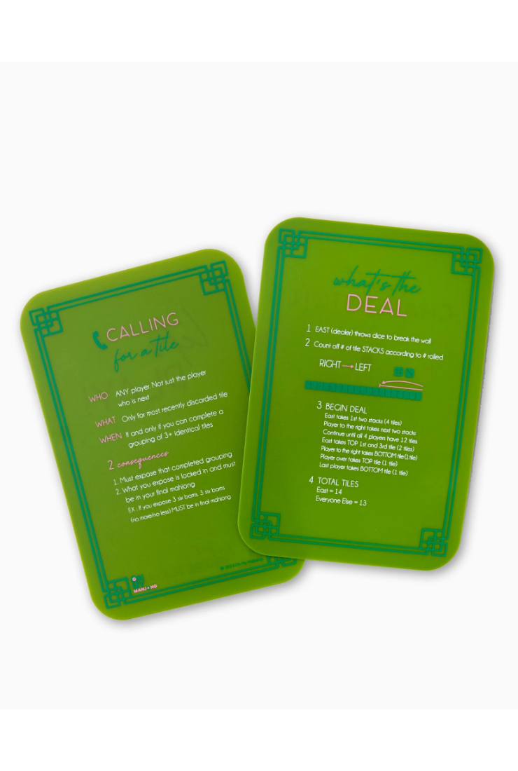 Two green playing cards with white text, showing the front and back of a card design on a light gray background.