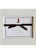 A white rectangular card or envelope with a thin brown border, featuring a small brown cowboy boot illustration near the top and wrapped with a dark brown ribbon bow, shown against a light neutral background.