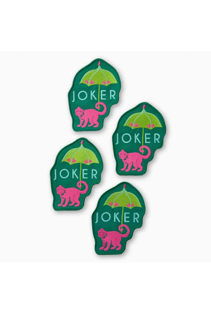 Five green stickers with pink monkey illustrations and 'JOKER' text on a white background