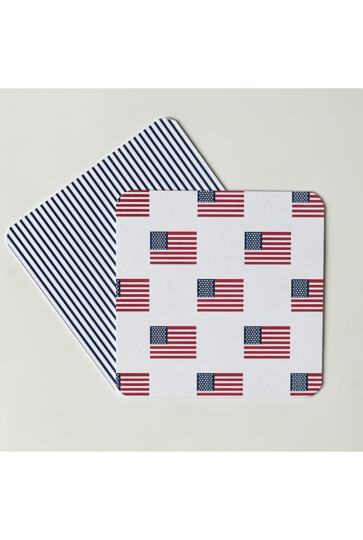 Two placemats with American flag pattern on a white background