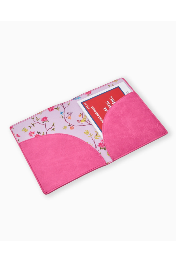Pink pouch with floral design on a white background