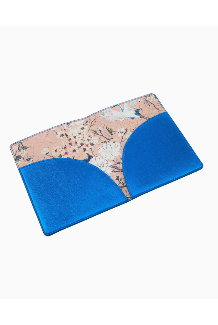 Blue and floral-patterned cushion on a white background