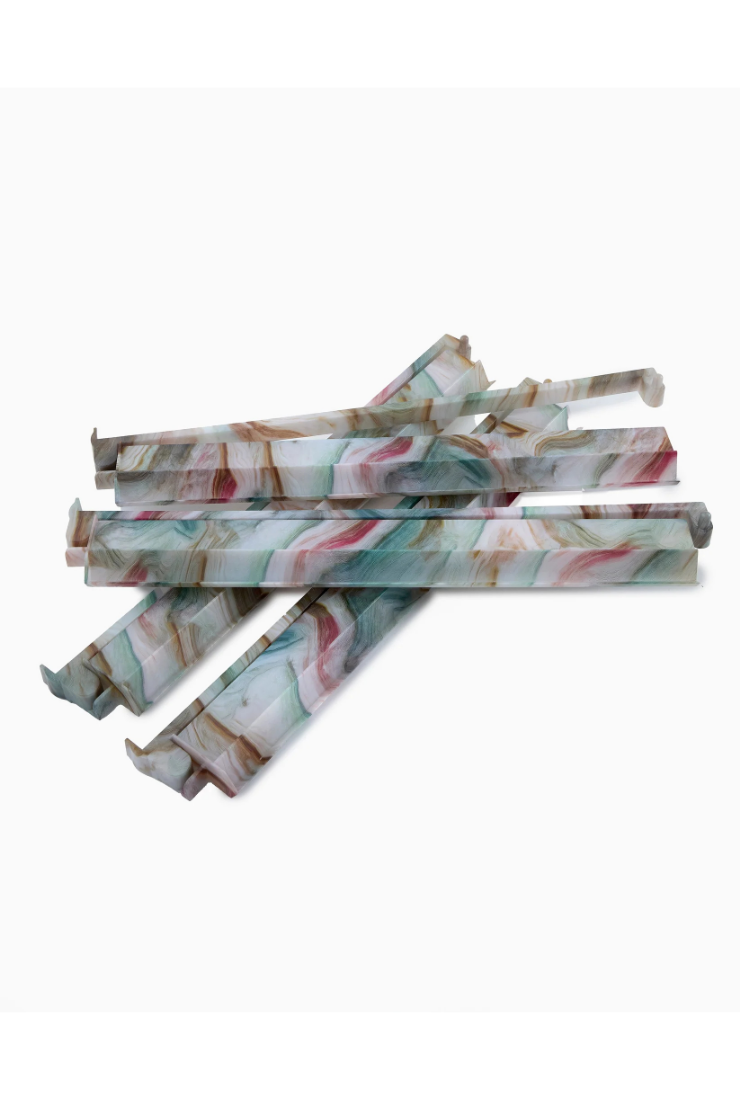 Marbled patterned sticks on a white background