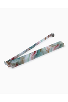 Floral-patterned tongs on a white background
