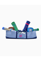 Blue and navy bag with various items including bottles and a box on a white background