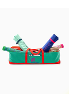 Green and red bag with stationery items on a white background