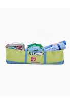 Green bag with colorful items on a white background