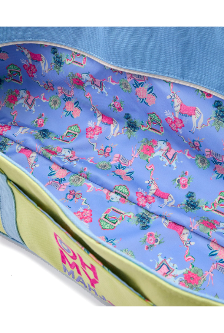 Colorful fabric with a pattern of cartoon characters on a blue background