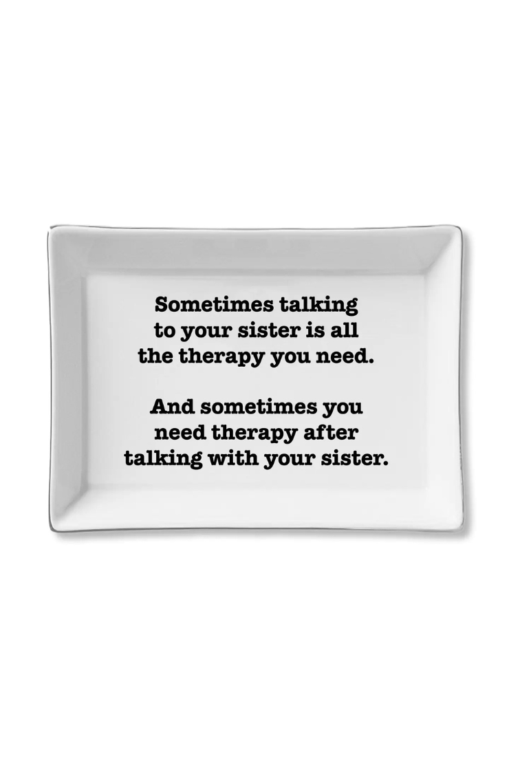 White rectangular tray with black text on a white background