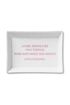 White tray with pink text quote by Coco Chanel on a white background