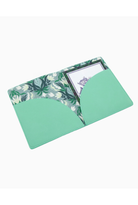 A mint green card holder or document pouch with a tropical floral patterned interior lining, shown open on a plain white background.