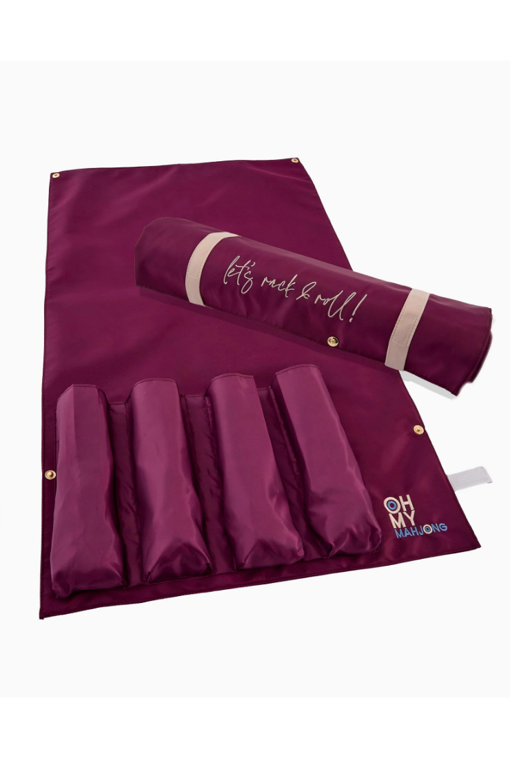 A burgundy nylon hair roll organizer with five vertical pockets, shown partially unrolled with a matching rolled-up section resting across the top. The top section features the text 'let's rock 'roll!!' in white script, and the bottom right corner displays a gold and blue 'MHW MARY HAWKS' logo.