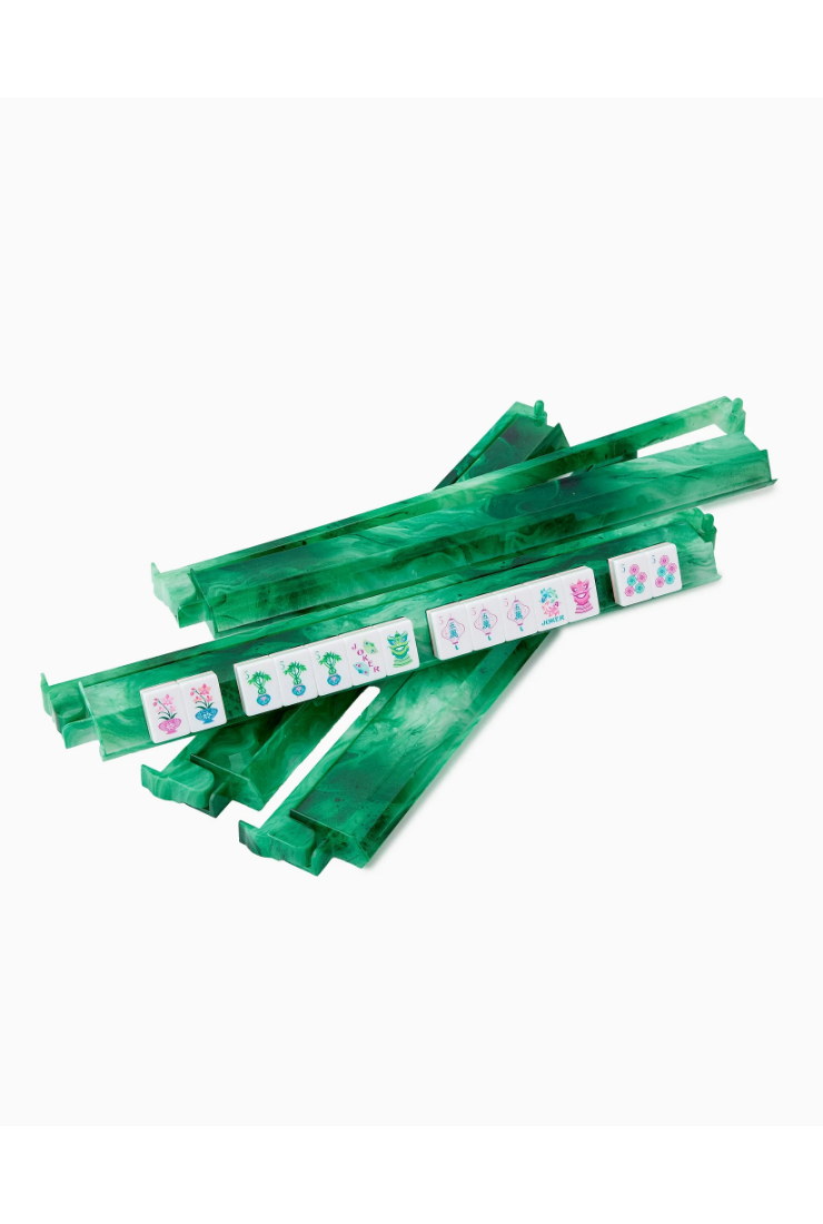 A set of translucent green plastic game sticks, likely for a card or board game, arranged on a plain white background.
